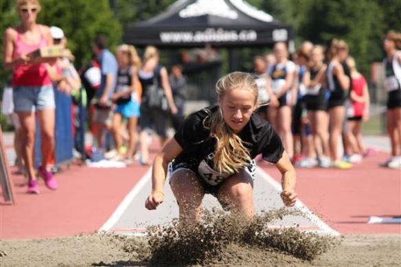 Emma Celle competes in long jump at Jesse Bent